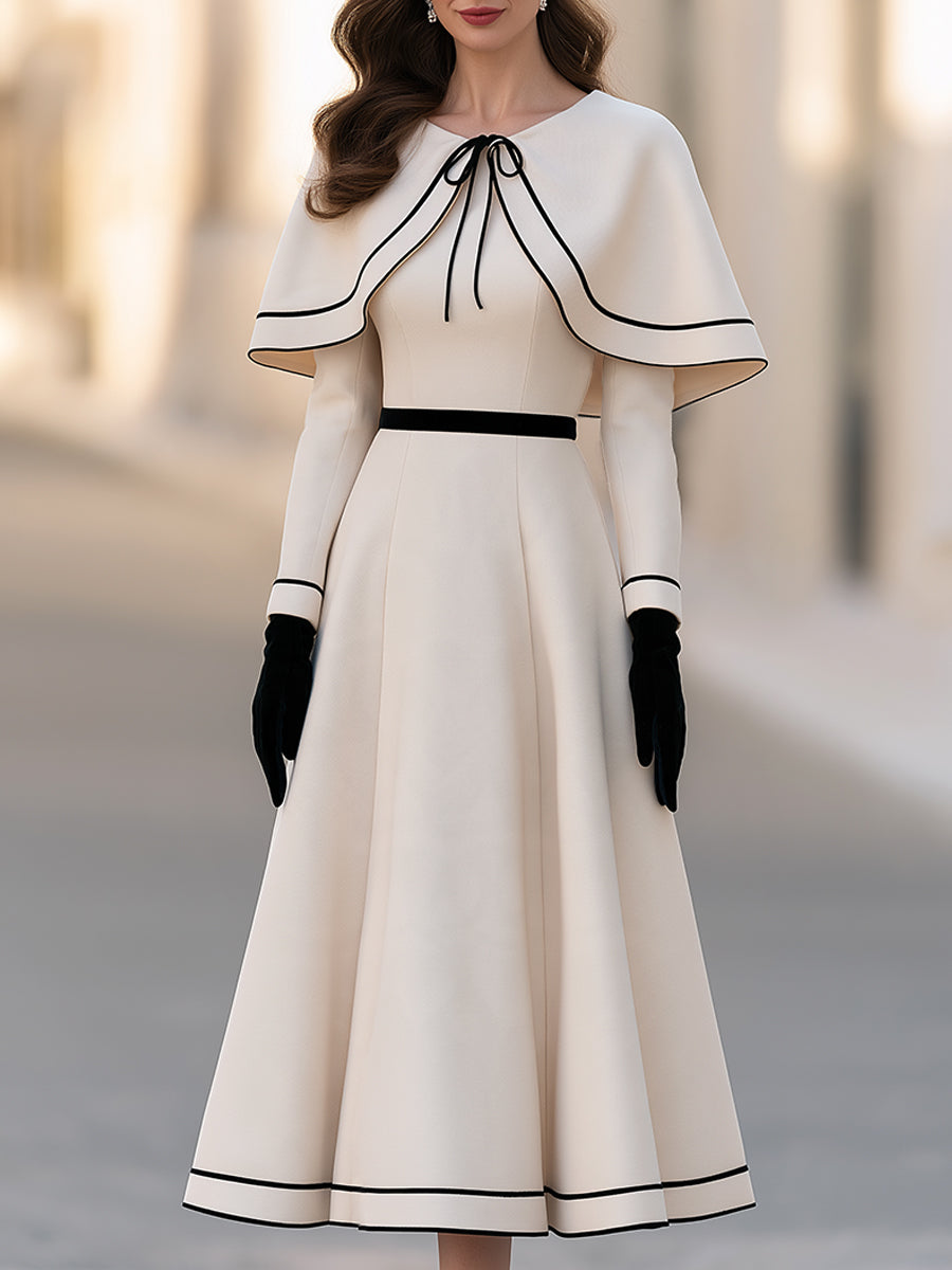 Two-piece Set Featuring An Ivory-white Cape With Black Piping And An A-line Midi Skirt