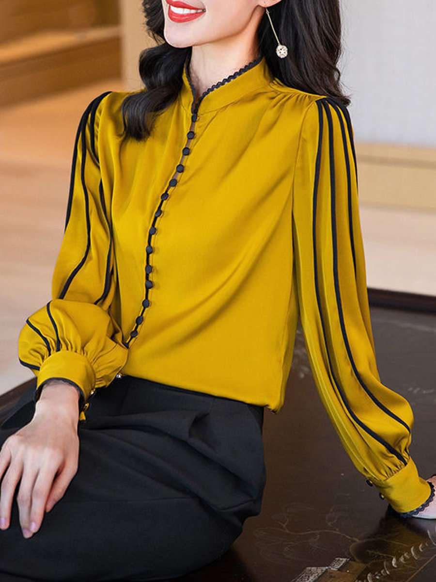 Elegant Blouse with Black Trim Accents