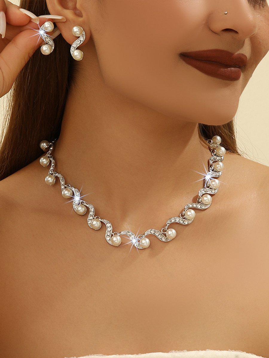 Elegant Pearl and Crystal Swirl Jewelry Set