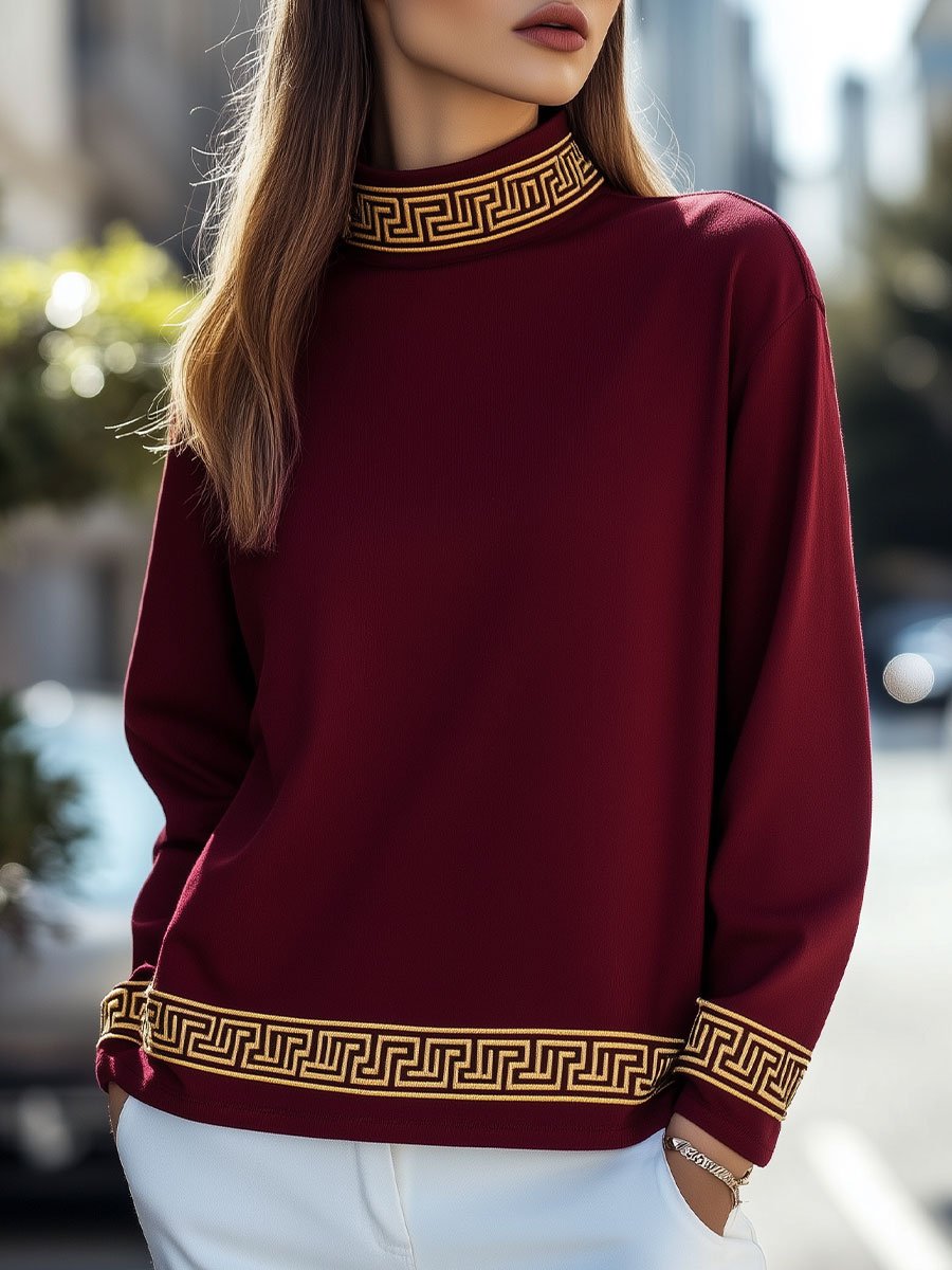 Elegant Burgundy Top with Intricate Gold Accents